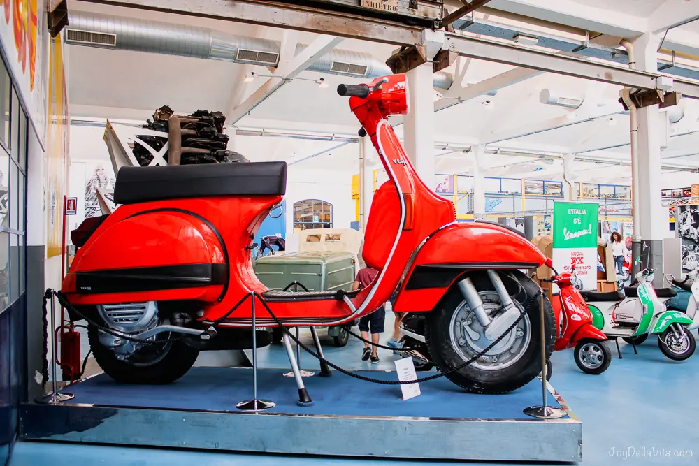 How to book your visit to / guided tour at Piaggio Museum in Pontedera 2 big red vespa